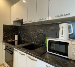 Апартаменты с кухней и спальней в Sibgat Apartments