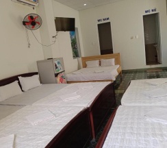 Кровать в общем номере в Vuta Hotel