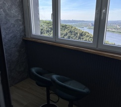 Четырёхместные апартаменты с балконом и с видом на город в Апартаменты Sensum Deluxe с панорамным видом на Оку