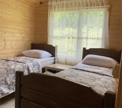 Лодж с вернадной и двумя односпальными кроватями в Arkhyz family lodge
