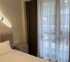 Апартаменты двухкомнатные четырехместные  (улучшенные) с балконом в Polikariya