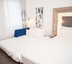 Номер стандарт семейный с 1 двуспальной кроватью в Novotel Krasnoyarsk center