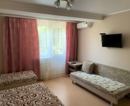 Четырехместный номер с 1 двуспальной или 2 односпальными кроватями в Танго