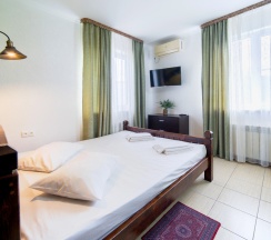 Двухместный номер Classic с видом на море и дендрарий двуспальная кровать в Delsochi