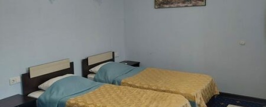 Кровать в общем номере в Royal