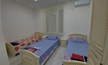 Кровать в 3-местном общем номере в Беной Тревел