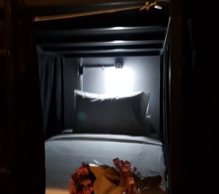 Кровать в общем номере в The Bed Hostel at Patong
