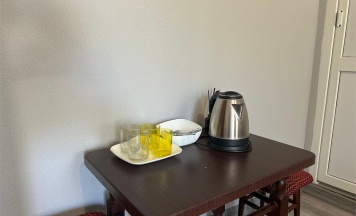 Комфорт с двуспальной кроватью в коттедже в Эльбрус