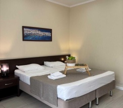 Комната стандарт с 1 двуспальной кроватью и диваном в Фортуна