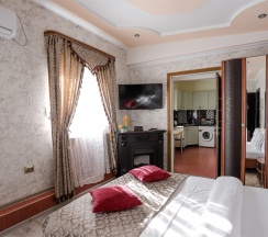 Студия-улучшенный семейный номер в Олимпия