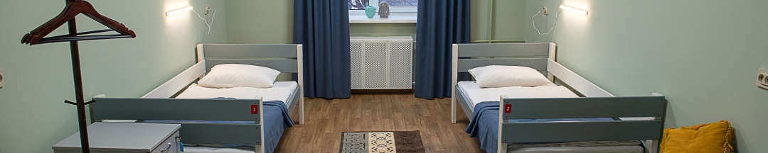 Кровать в двухместном номере с 2 отдельными кроватями в Рус-Арена