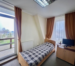 Трехместный номер с двуспальной и односпальной кроватями в Росситтен