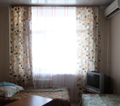 Кровать в общем номере (общая ванная комната) в Кировская