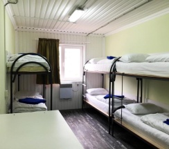 Кровать в общем номере в Sky Hostel