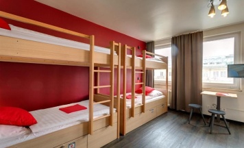 Кровать в общем номере в MEININGER Hotel München City Center
