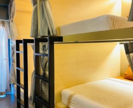 Кровать в общем номере c 1 комнатой в Rabbitel Phuket