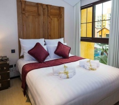 Семейный люкс с балконом в The Symphony Suites Pattaya