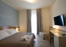 Трёхместный номер в Le Ginestre Family Wellness Hotel