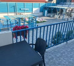 Двухуровневый ПОЛУЛЮКС с зоной отдыха на крыше и видом на бассейн в Santorini Family Club