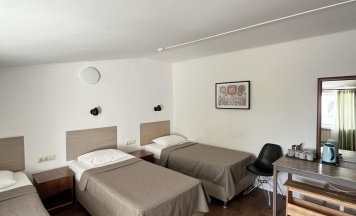 Номер стандарт с 4 односпальными кроватями в Домино