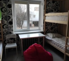 Кровать в общем номере (общая ванная комната) в В библиотеке