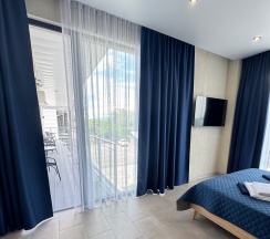 Стандарт с видом на окрестности и общим балконом (dbl+Extra Bed)) в Costa d`Ora