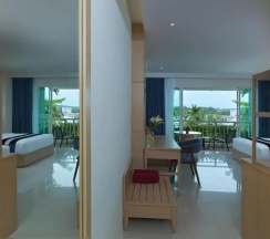 Двухместный номер Grand Deluxe с балконом 2 отдельные кровати в Chanalai Flora Resort, Kata Beach