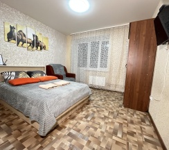 Апартаменты стандарт с двуспальной кроватью и креслом диваном в Апартаменты NHome