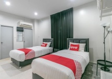 Двухместный номер Economy 2 отдельные кровати в OYO 818 Suksomboon Residence