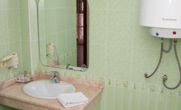 Номер стандарт с 2 односпальными кроватями в коттедже в Ателика сокол