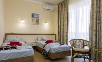 Номер стандарт с 2 односпальными кроватями с балконом в ТриО