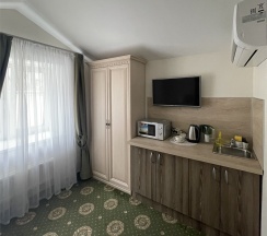 Стандартный номер с кухней с одной большой кроватью в Старосадский