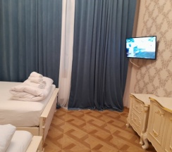 Стандартный четырехместный номер с 2 двуспальными кроватями в За рулем Юг