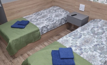 Кровать в общем номере в Плесецкая