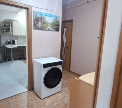 Люкс номер для семьи с большой кроватью и кухней в Гостевой дом