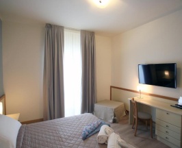 Трёхместный номер в Le Ginestre Family Wellness Hotel