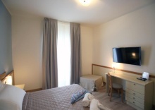 Трёхместный номер в Le Ginestre Family Wellness Hotel