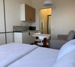 Уютная студия на 13 этаже с панорамным видом на Каспийское море. в Как Дома 05