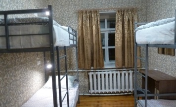 Кровать в общем номере в Бумeранг