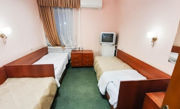 Кровать в 3-местном общем номере в Smart Hotel KDO Белгород