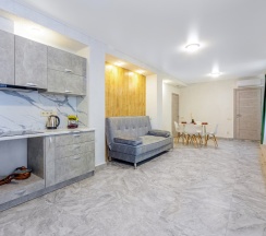 Двухместные Люкс Апартаменты с кухней с 2 комнатами двуспальная кровать в Гости Кавказа