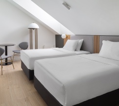 Двухместные апартаменты Deluxe Мансарда 2 отдельные кровати в The Basilian Minsk, Curio Collection by Hilton