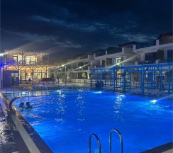 ПОЛУЛЮКС с патио и видом на море в Santorini Family Club