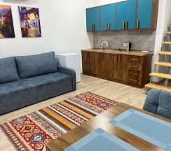 Двухуровневый ПОЛУЛЮКС с зоной отдыха на крыше и видом на бассейн в Santorini Family Club