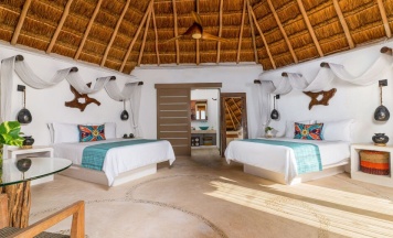 Двухместный номер oceanfront 2 отдельные кровати в Shangri-la Caribe Beach Village Resort