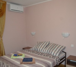 Четырёхместный номер Comfort с красивым видом из окна в Березка