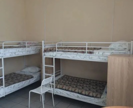 Кровать в общем номере в Мангазея