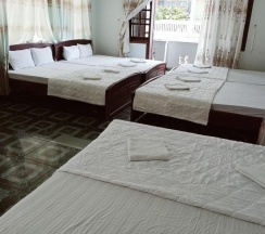 Кровать в общем номере в Vuta Hotel