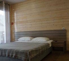 Номер-студия с двухспальной кроватью king size и диван-кровать в Дом мечты