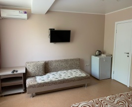 Четырехместный номер с 1 двуспальной или 2 односпальными кроватями в Танго